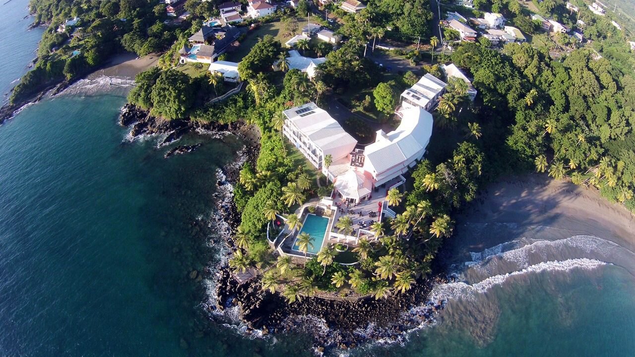The Blue Haven Hotel on its point above Bacolet Bay